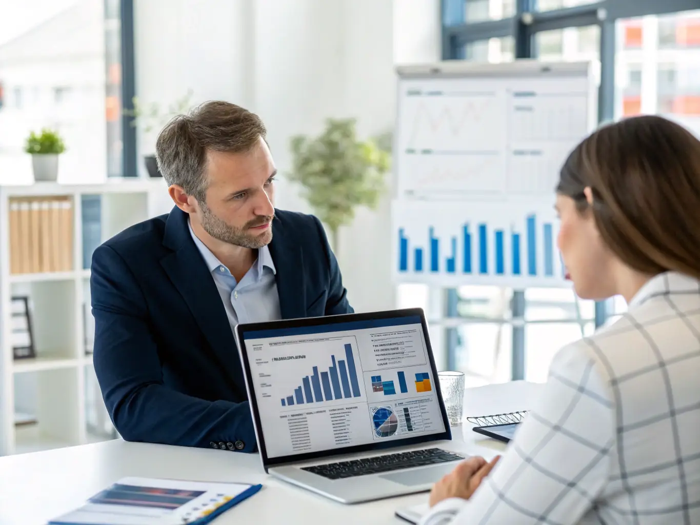 A financial advisor consulting with a client, illustrating the personalized financial advice available through Mercury Bank.